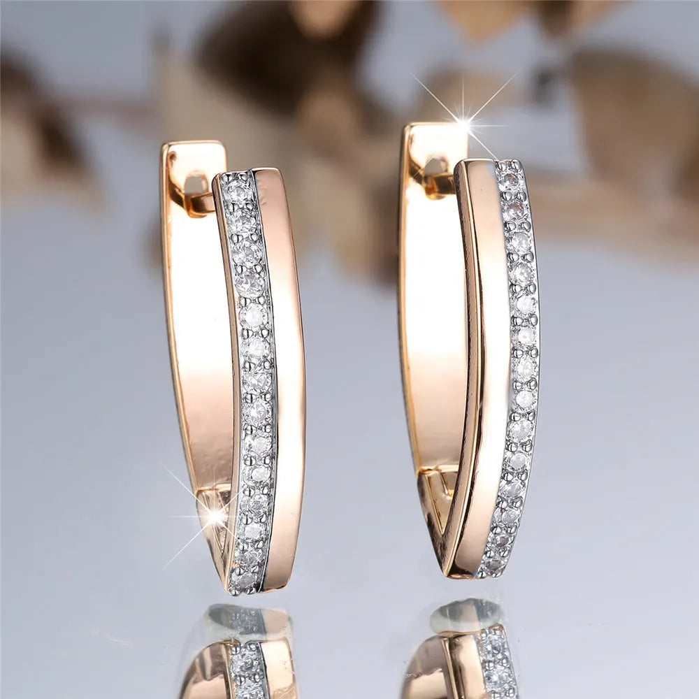 Geometric V-shaped women's clip-on earrings with champagne gold electroplating and white diamond accents