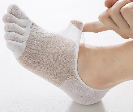Pair of solid colour modal five-finger boat socks laid flat.