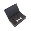 Black Bluetooth tyre pressure monitoring system kit with four external sensors, a wrench, and anti-theft screws on a white background