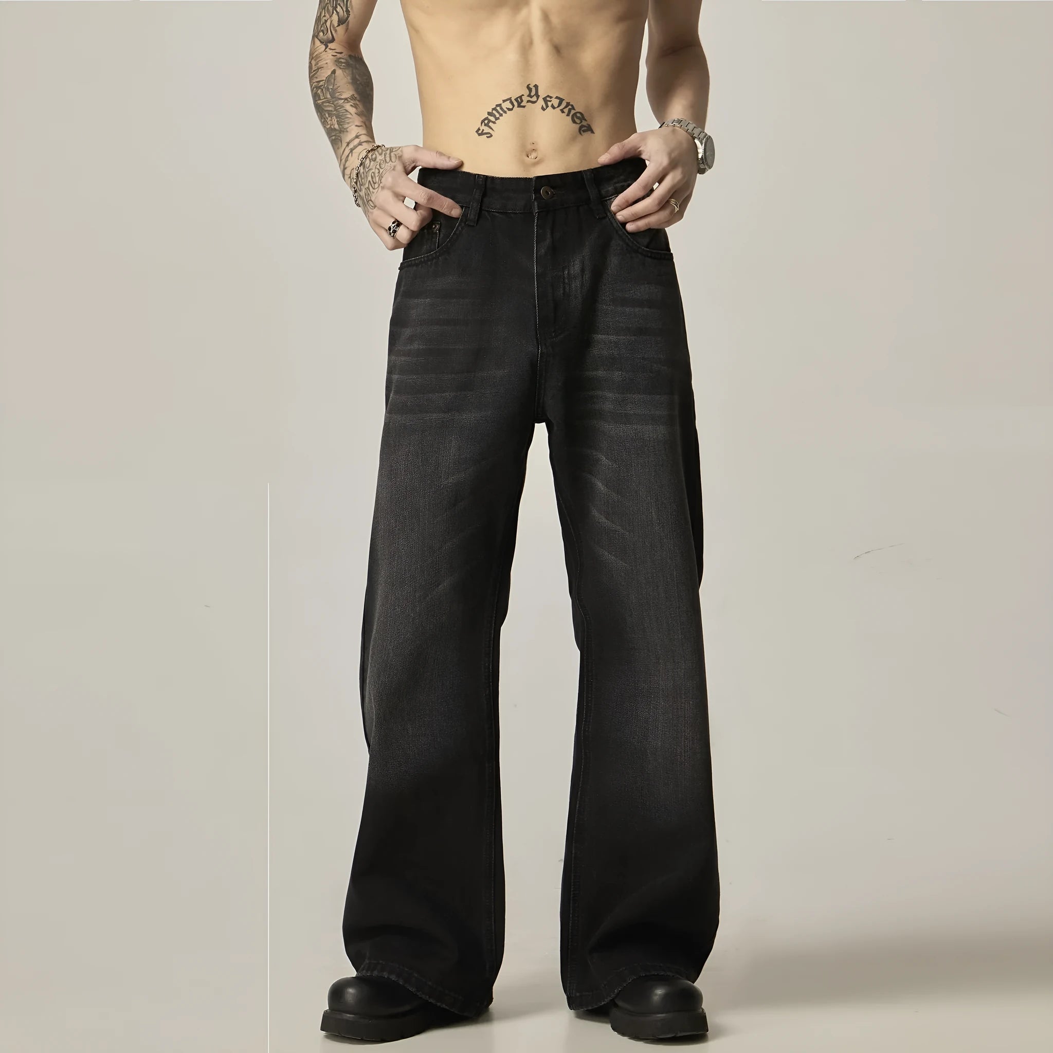 Black loose-fit straight-leg retro jeans on a mannequin, showing zip fly and casual style.
