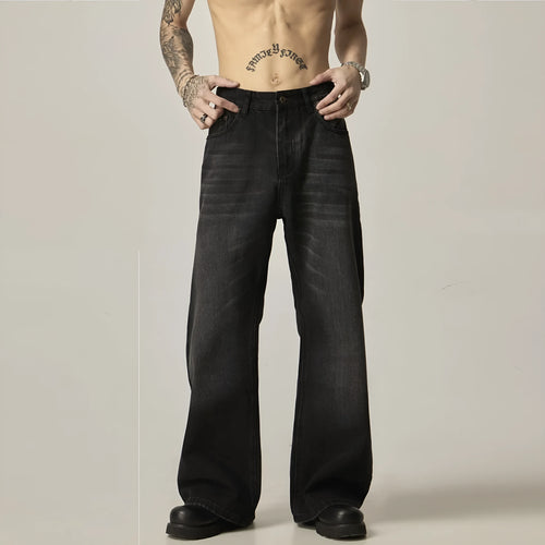 Black loose-fit straight-leg retro jeans on a mannequin, showing zip fly and casual style.