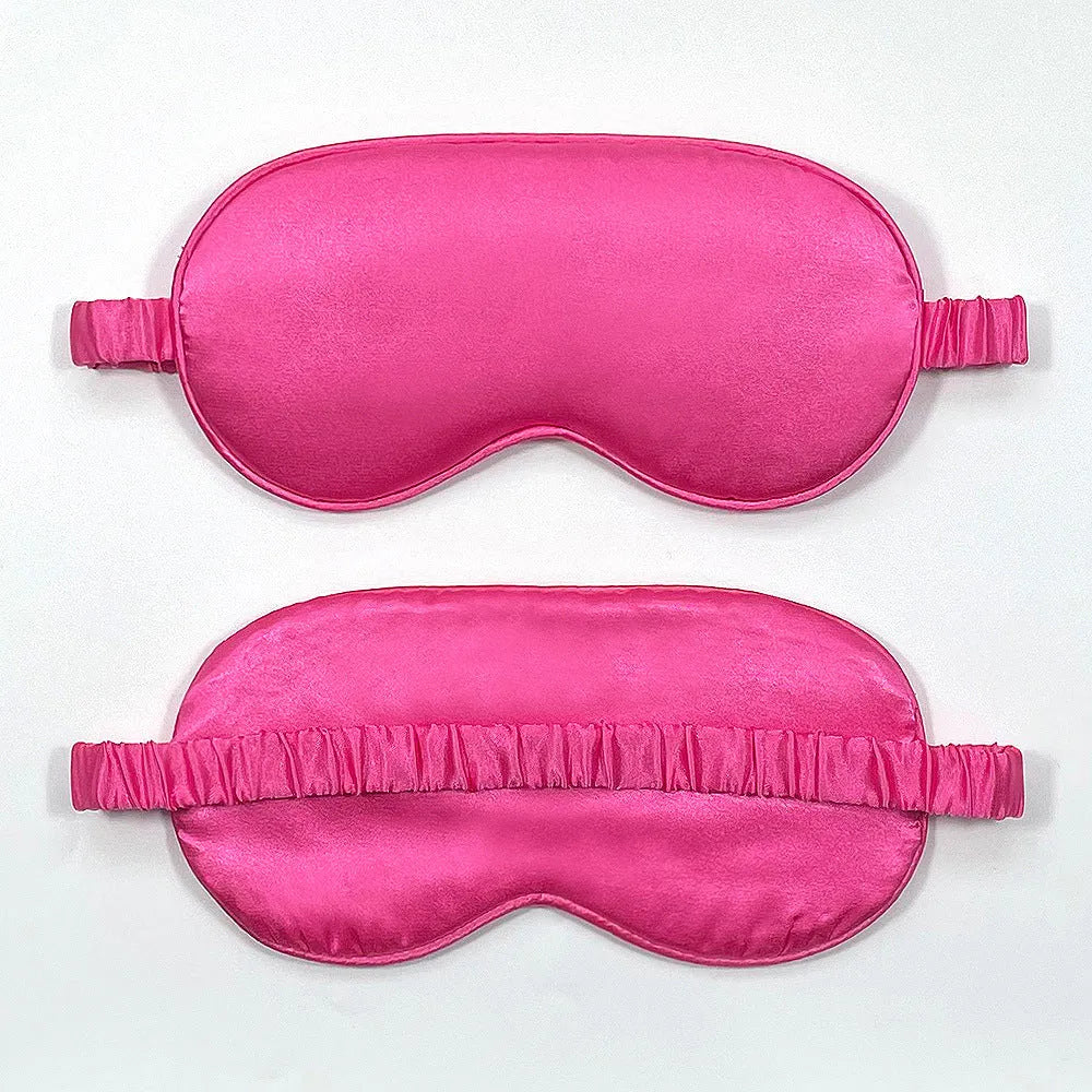 Reversible silk-like sleep eyeshade shown in multiple colour options including sky blue, wine red, and black.