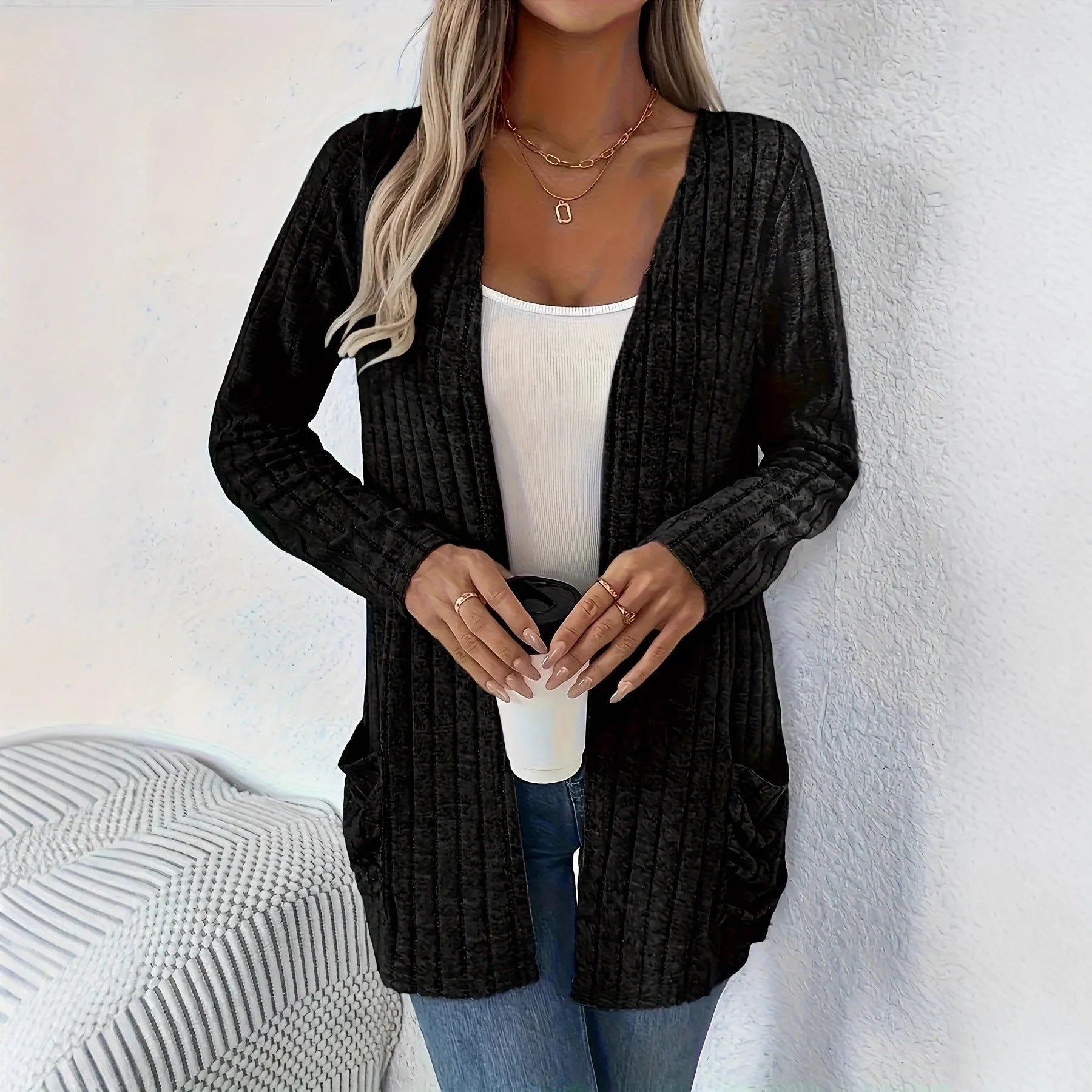 A loose-fit, solid colour long sleeve cardigan for women with a chest pocket, shown in grey and black.