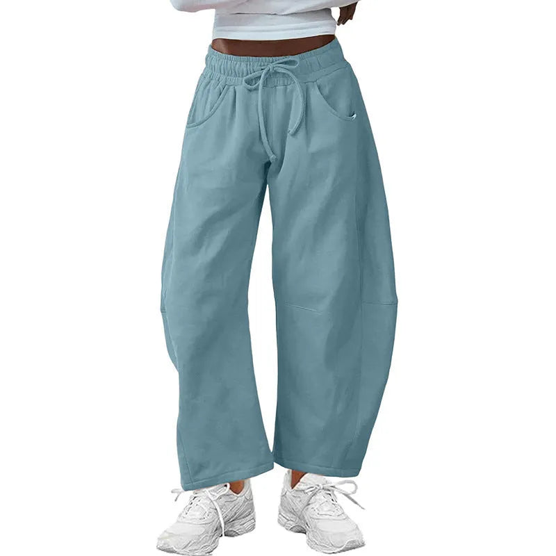 Loose cropped sweatpants with drawstring waist and side pockets in European street style