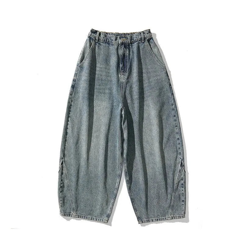 Men's plus-size baggy jeans in light blue denim with straight legs and low waist.