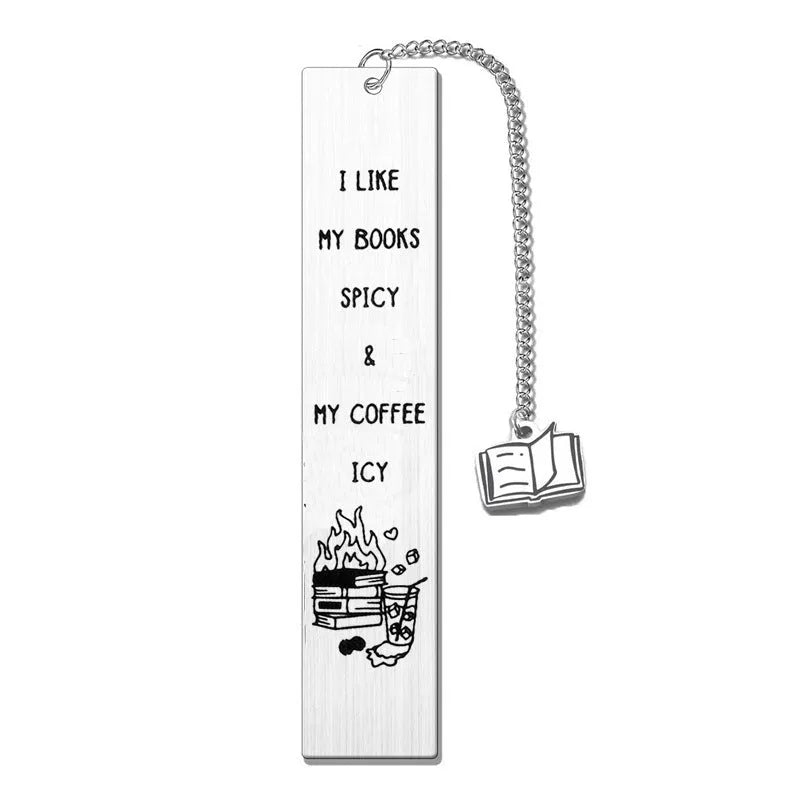 Stainless steel tassel-style bookmark with engraved 'reading enthusiasts literary' text on a metal surface.