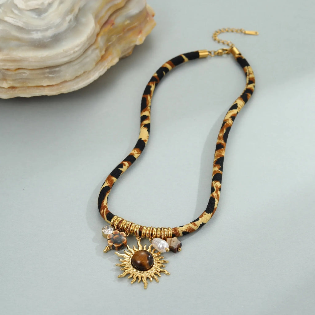 Geometric leopard pendant necklace with gold electroplated finish on adjustable stainless steel chain