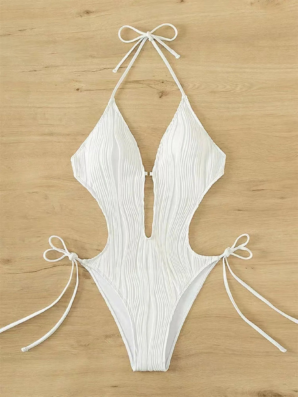 Women's black lace-up triangle bikini swimsuit with tie detail and solid colour design