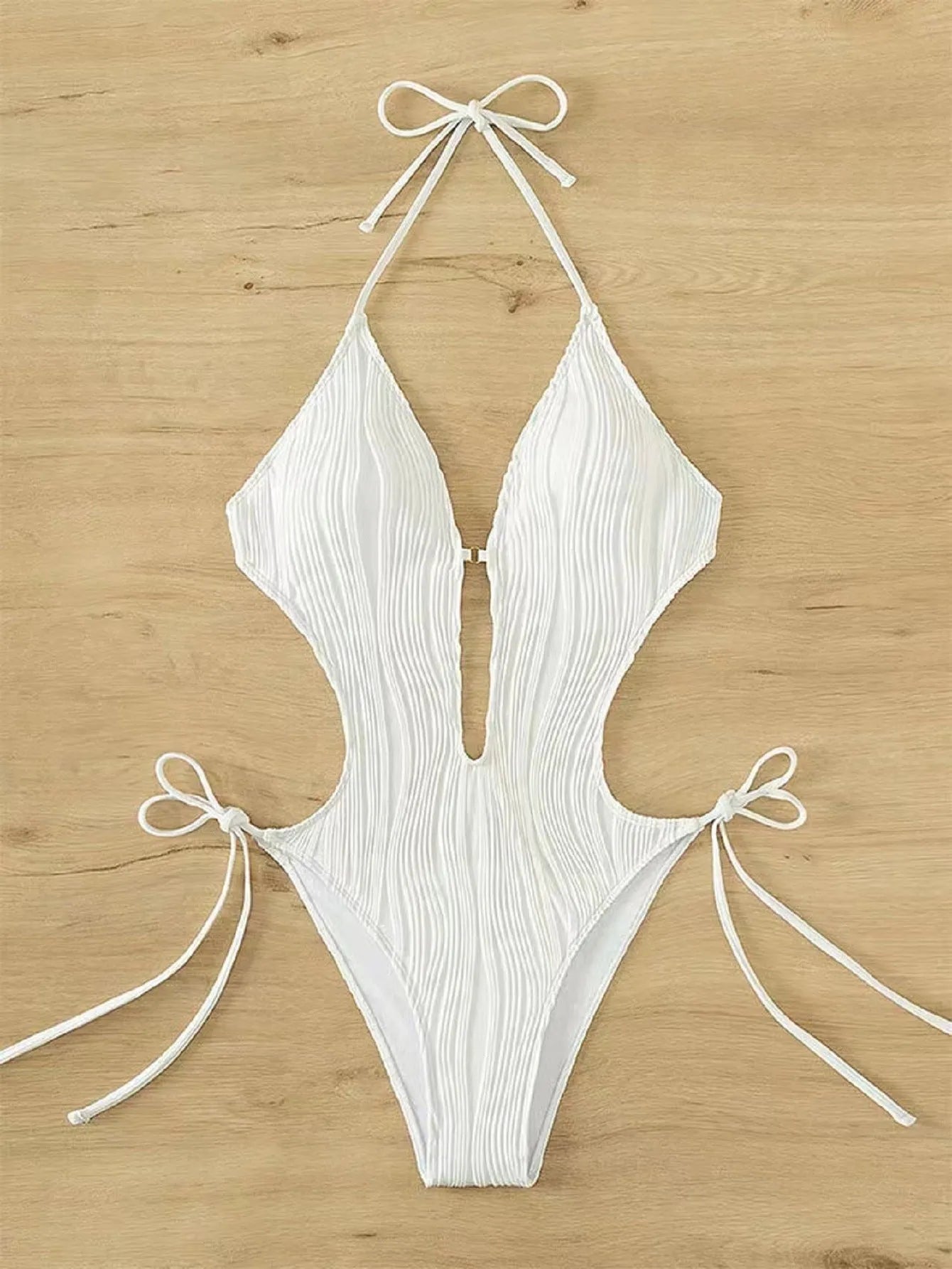Women's black lace-up triangle bikini swimsuit with tie detail and solid colour design