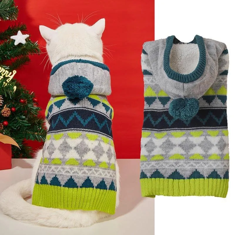 Green diamond pattern knitted acrylic sweater on a small dog, showing ribbed cuffs and classic knit design.