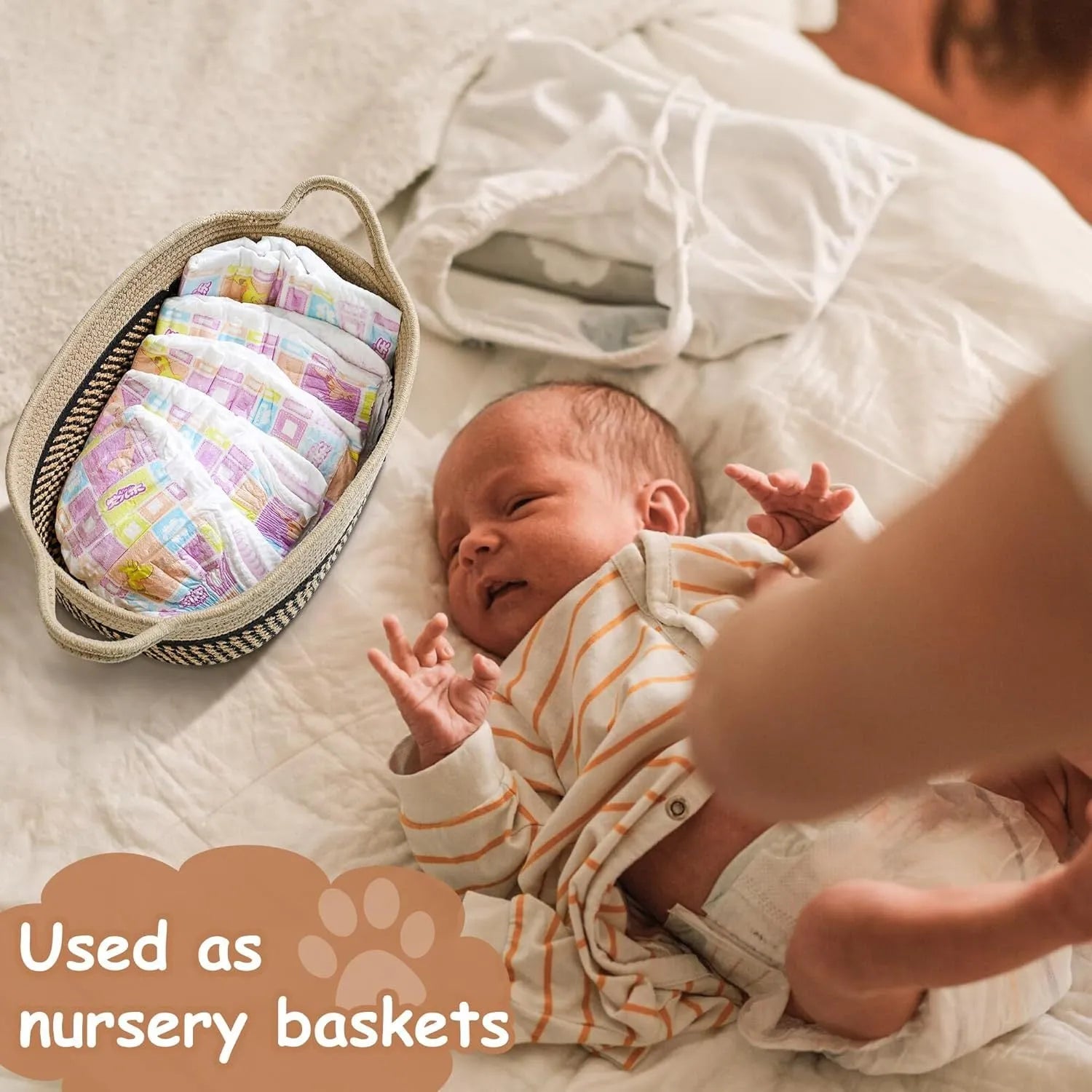 Light beige handmade cotton rope storage basket with wooden handle on a table.