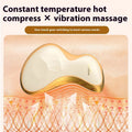 Gold coloured electric Gua Sha facial massage tool with a smooth metal scraping plate.