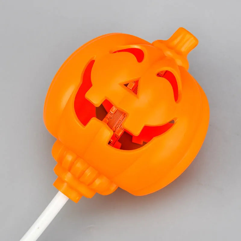 Plastic pumpkin-shaped decorative lamp with USB cable, showing purple or yellow light option.