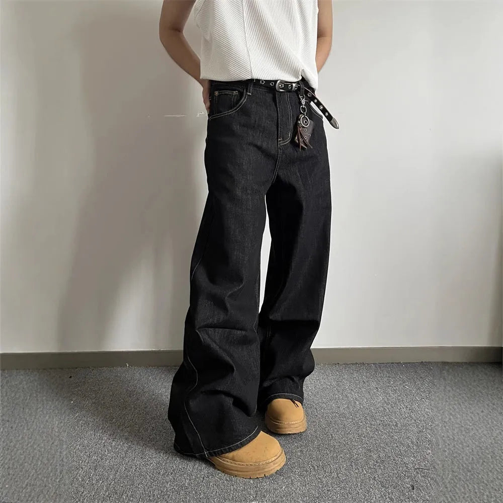 Black loose fit wide-leg denim jeans with a straight leg and mid waist on a hanger.