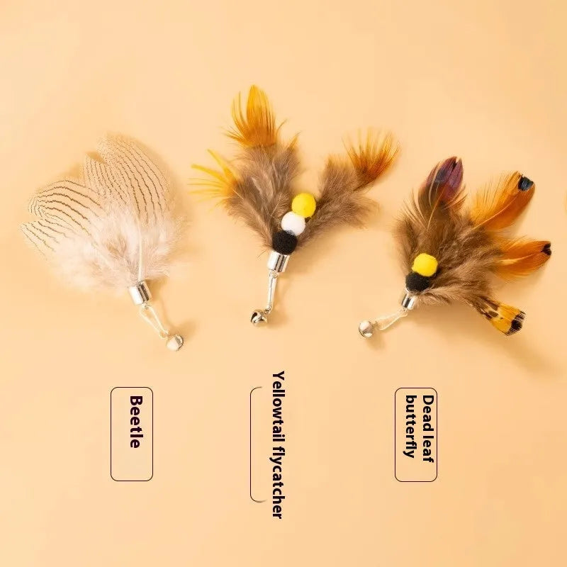Three steel wire cat toy replacement heads with flying insects design on a plain background