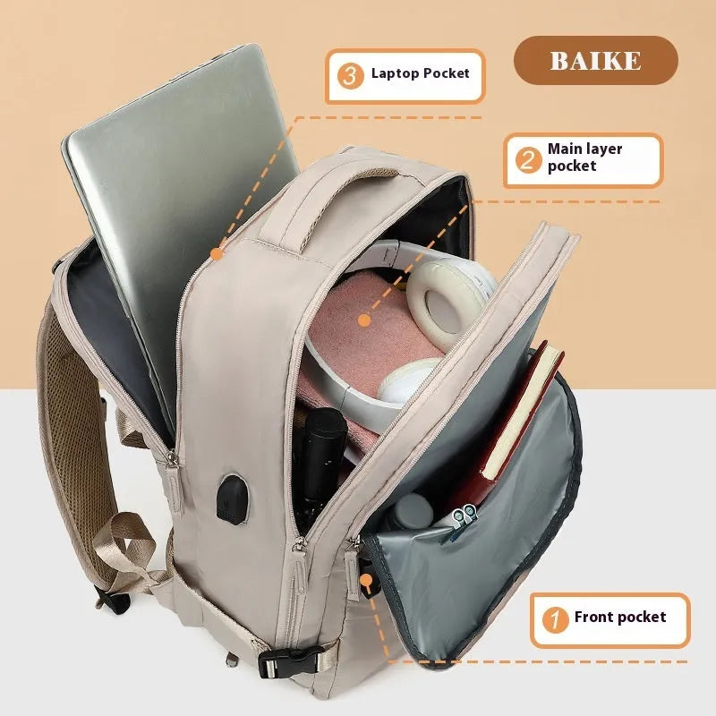 Large grey lightweight Oxford cloth travel backpack with curved shoulder straps shown from the side.