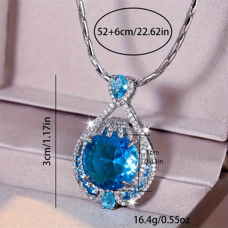 Blue geometric crystal pendant necklace with fireworks cut design on water wave chain