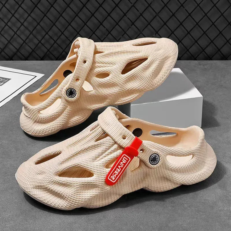 Men's grey coconut slippers with closed toe design and EVA construction on wooden deck