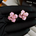 Gold plated purple oil-spot glaze flower stud earrings with copper construction and detailed floral design