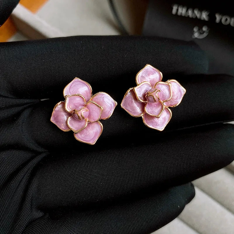 Gold plated purple oil-spot glaze flower stud earrings with copper construction and detailed floral design