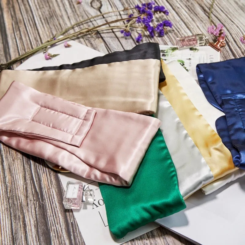 Mulberry silk sleep eye mask shown in multiple colours including black, champagne gold, and navy blue.