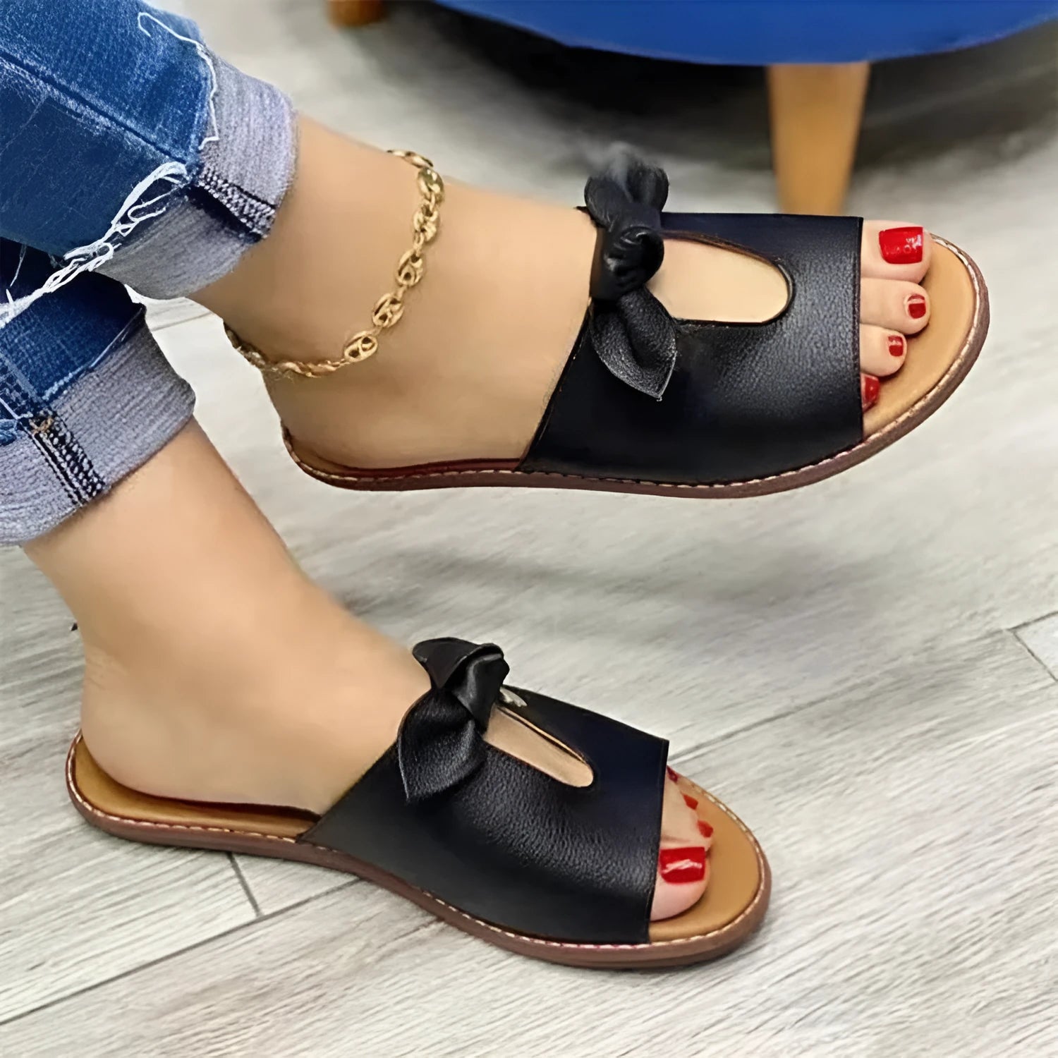 Women's black fish mouth sandals with a bow detail on the artificial PU upper and a rubber sole.