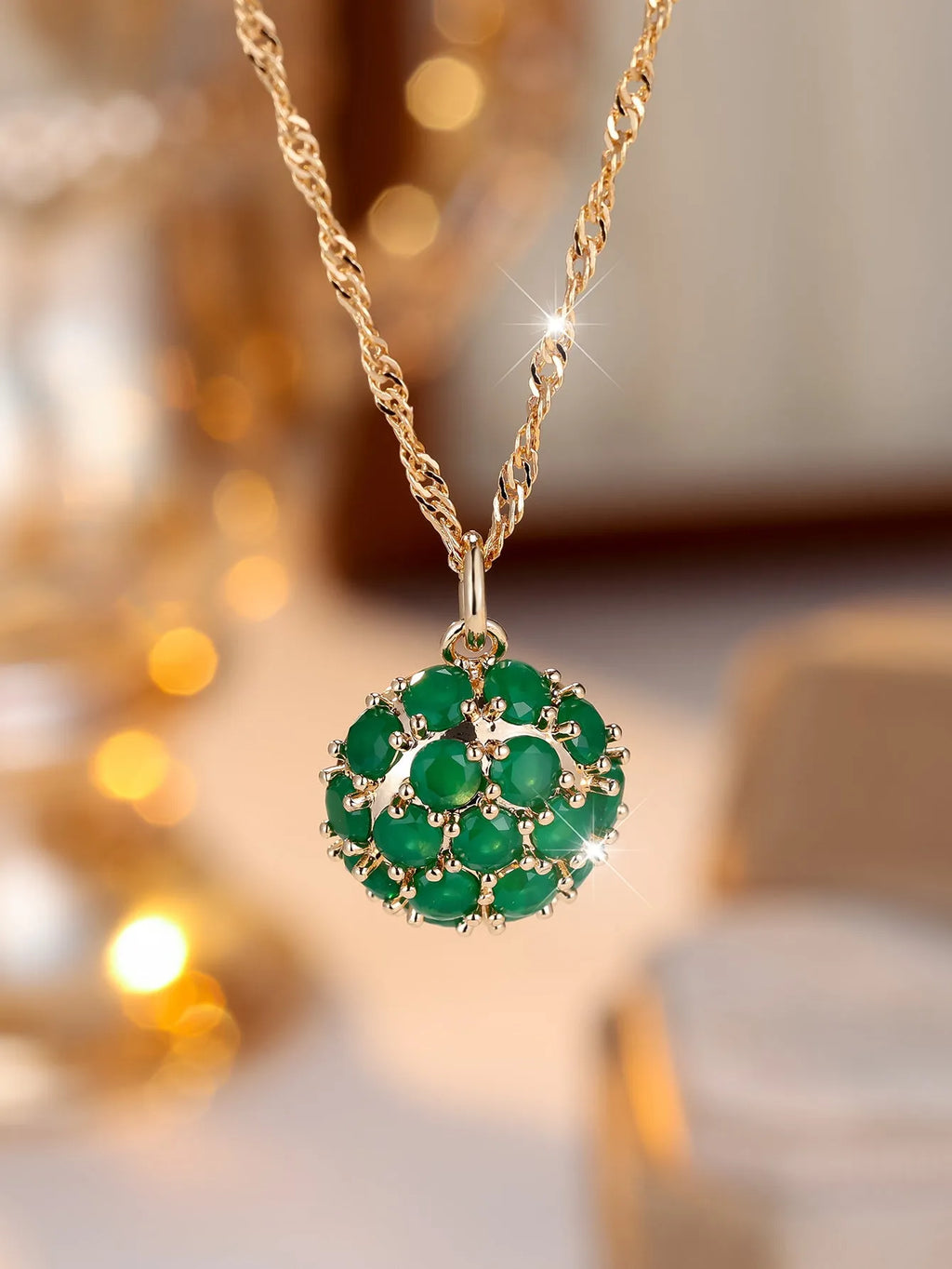 Round emerald pendant necklace with full diamond detailing in champagne gold colour on chain