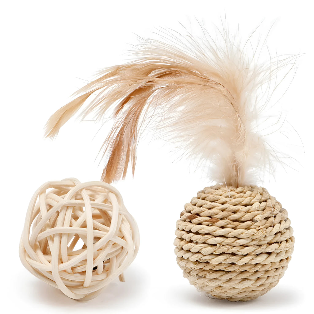 Two cat toys: hollow rattan ball and faux feather ball with bell on primary coloured background