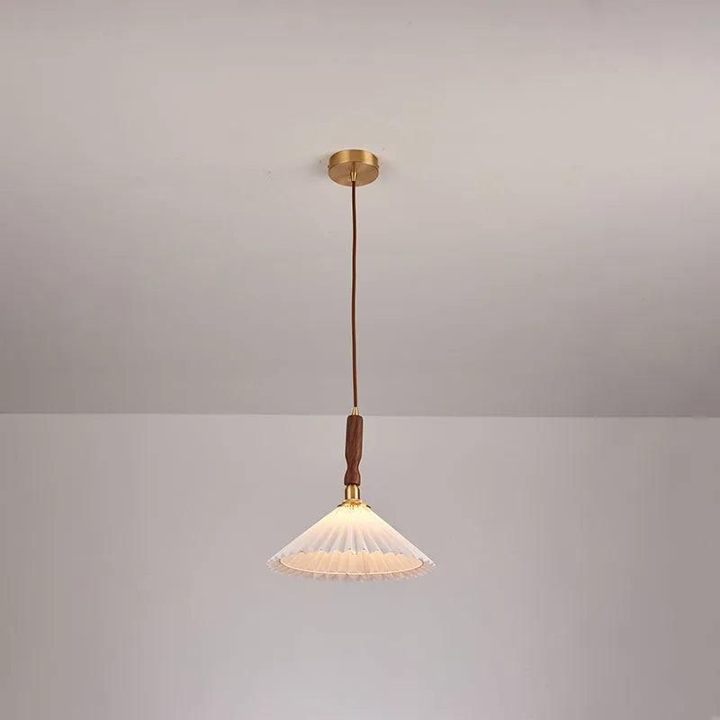 American retro walnut wood wall lamp with fabric shade in bedside setting