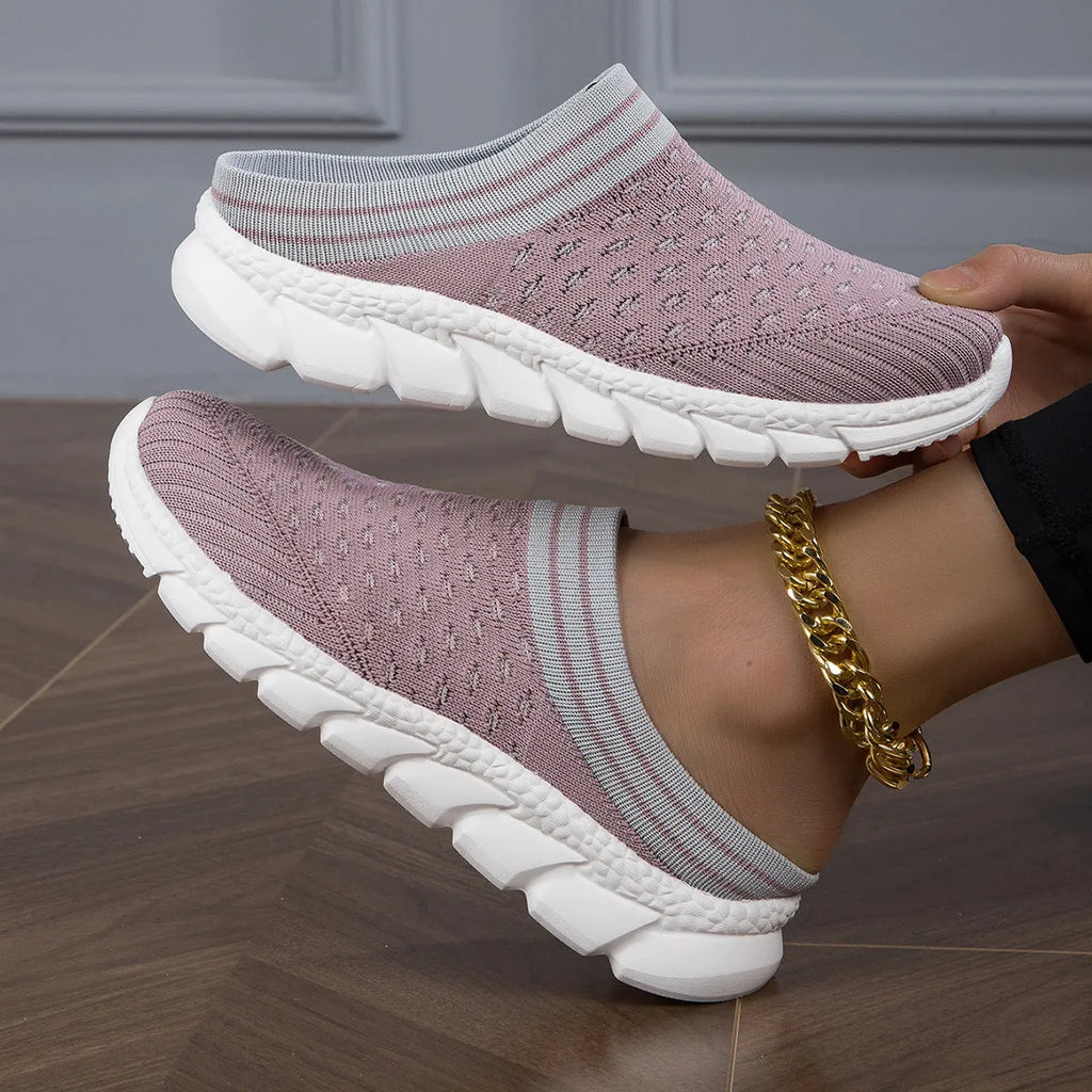 Women's black Flyknit slipper shoes with striped pattern and hollowed-out design on a lightweight viscose sole.