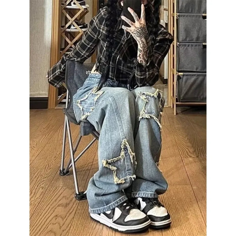 Blue high-waisted wide-leg women's jeans made from cotton denim on a model.