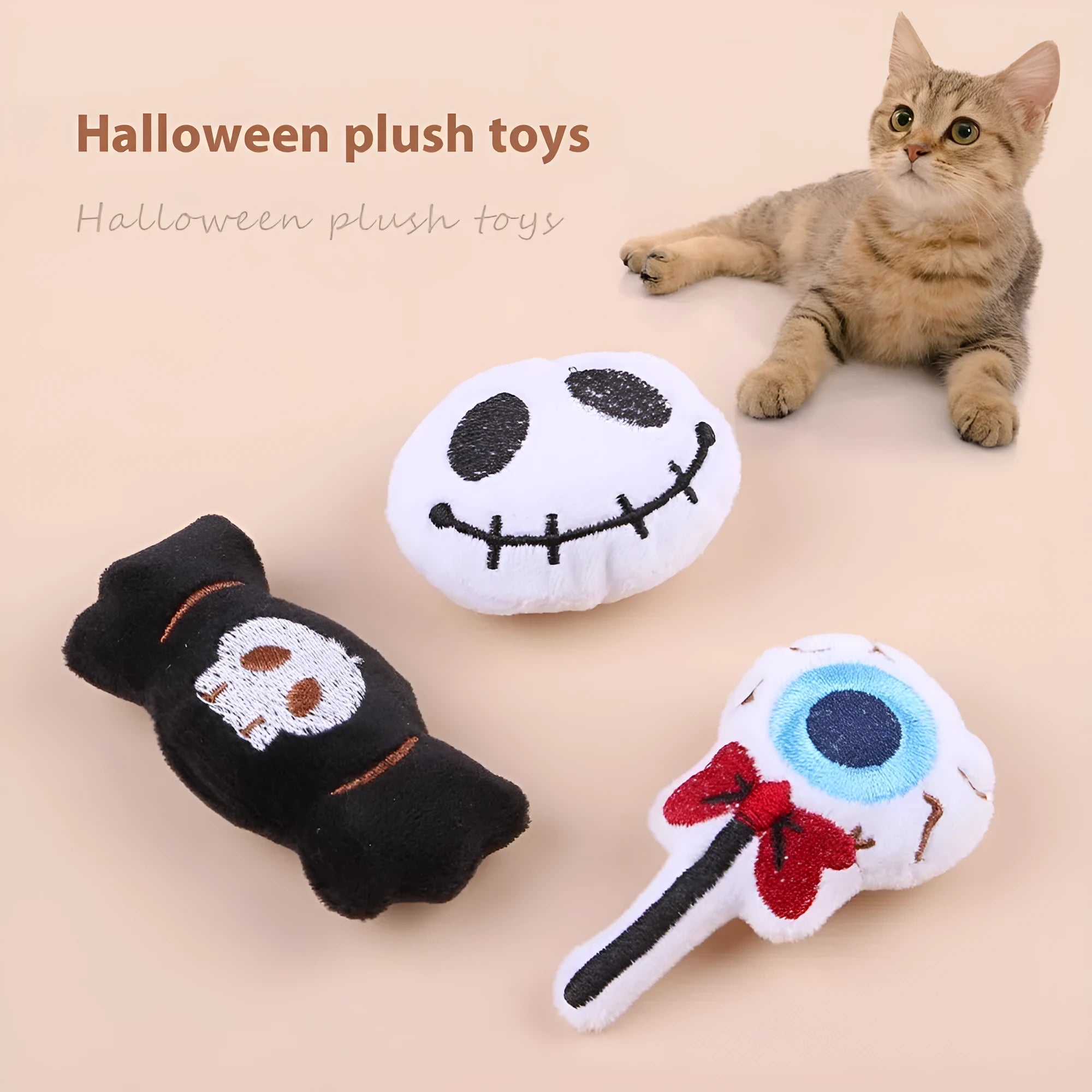 Small plush cat teaser toy with candy, eyes and skull attachments on lightweight handle