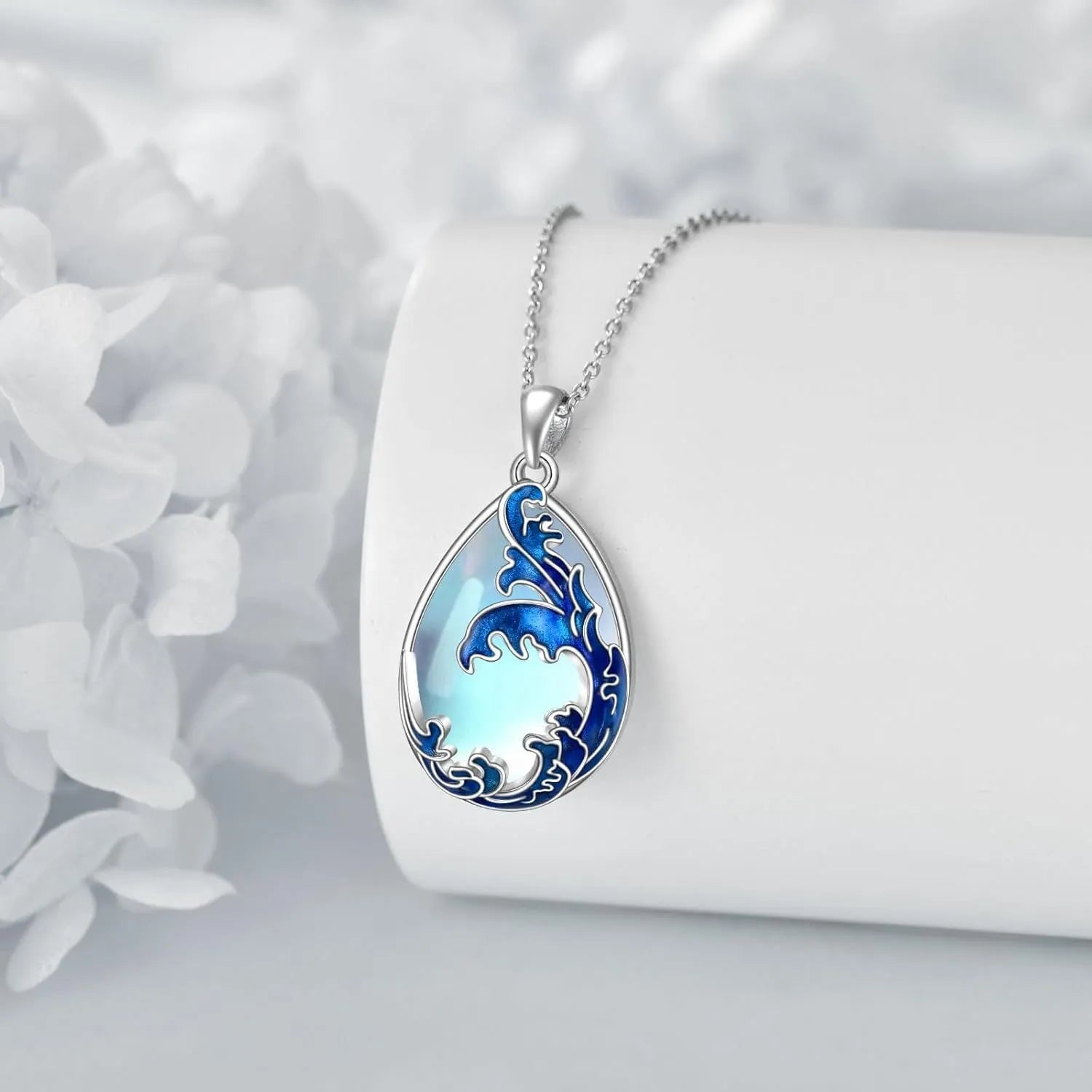Blue heart-shaped pendant necklace with alloy chain on display