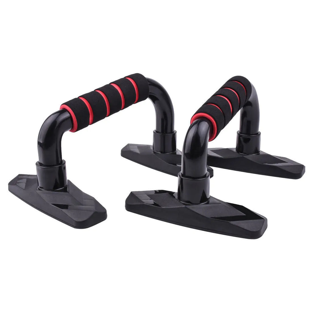 Pair of black I-shaped push up bars with textured PP sponge grips on a floor