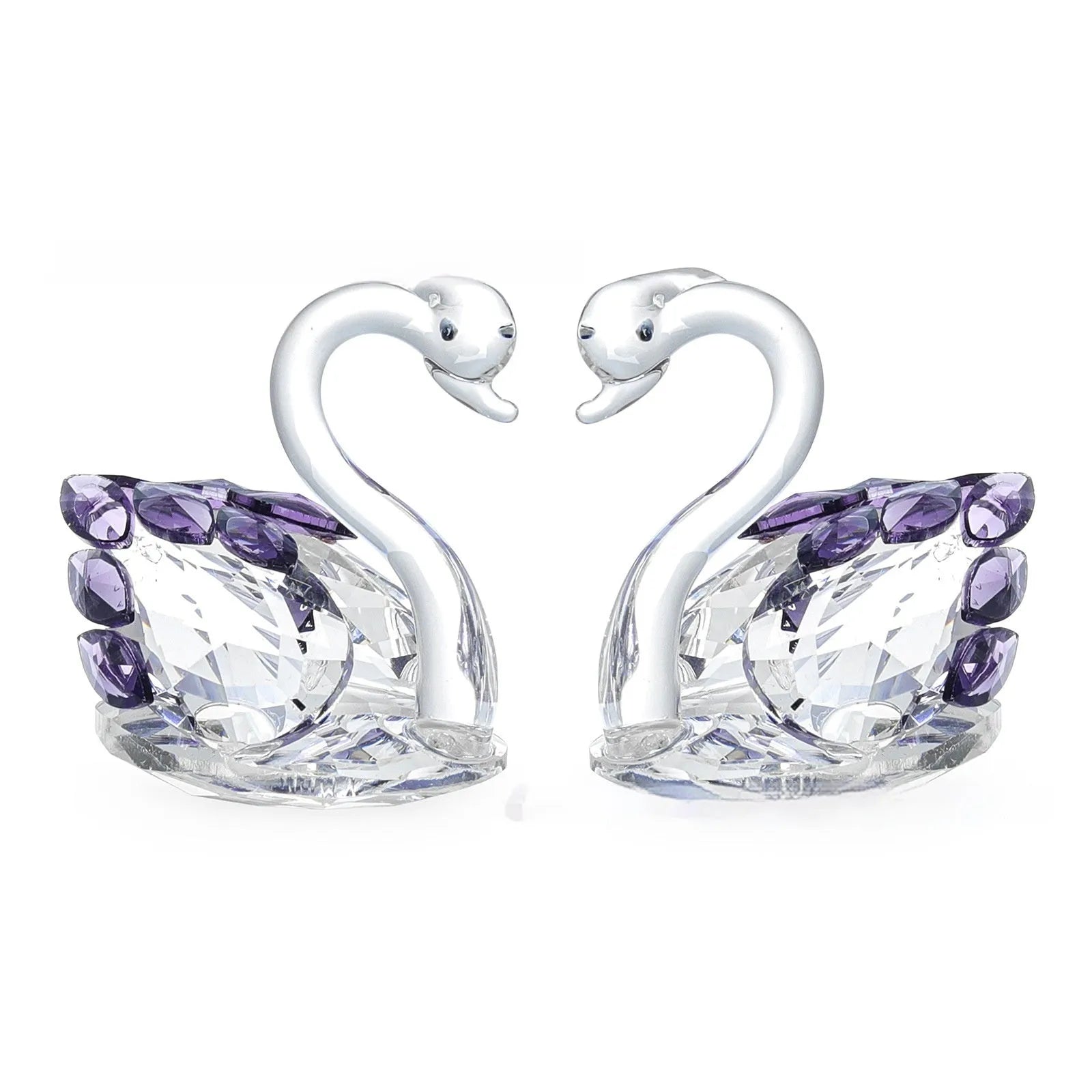 White crystal swan decoration on desktop with red, blue, pink, and violet colour options