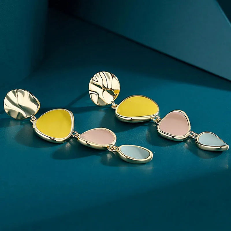 Morandi three-colour oil drip finish on disc-shaped alloy earrings with sterling silver posts.