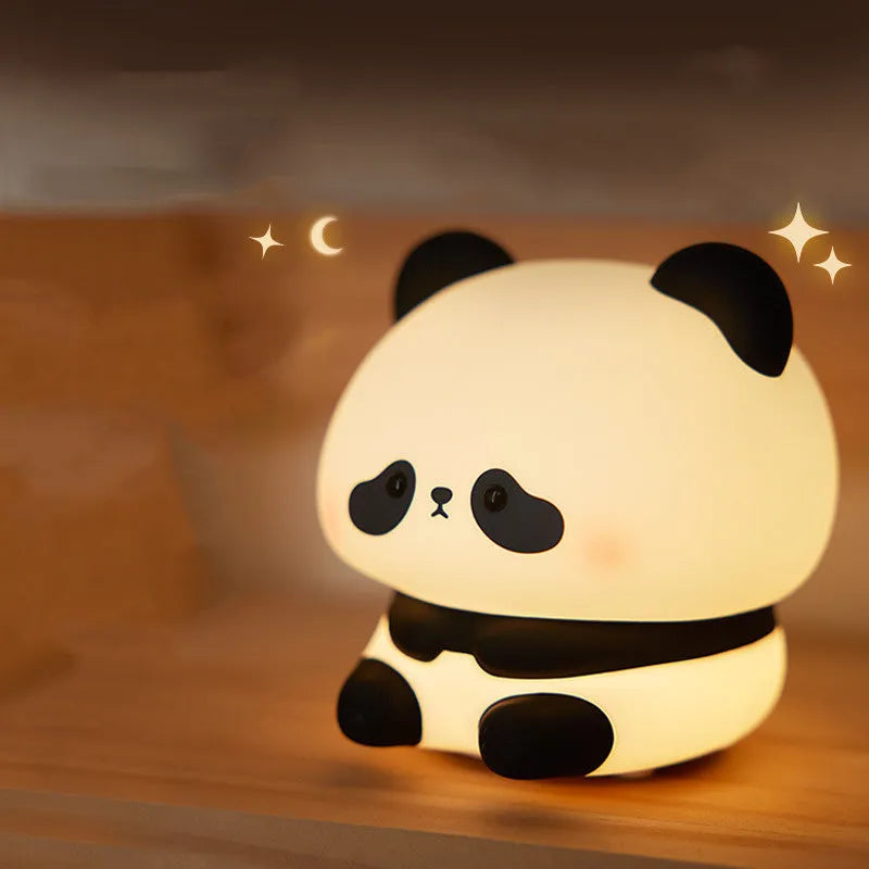 Cartoon panda-shaped night light with soft silicone construction and warm white LED glow