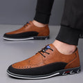 Men's black leather toe cap casual shoes with a fabric upper and rubber sole on a white background.
