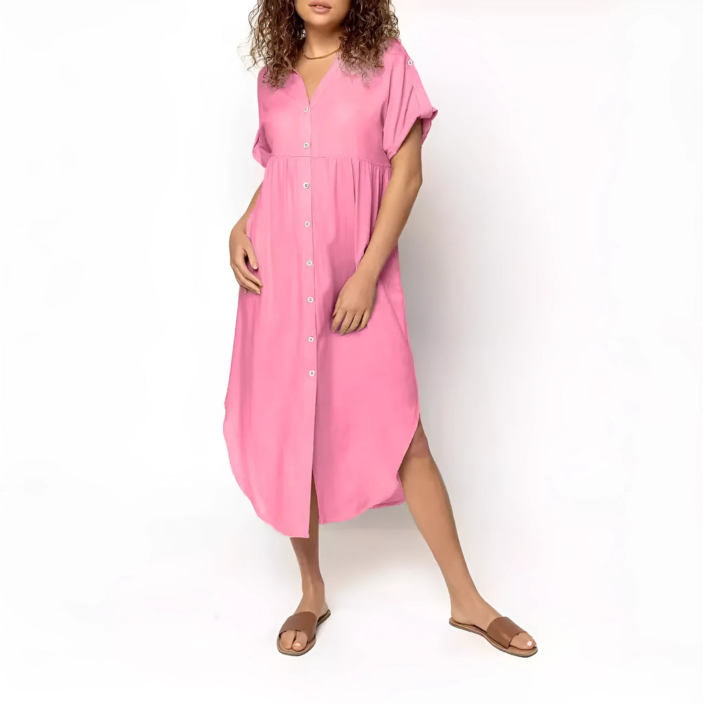 A loose-fitting, solid colour mid-length casual dress with a button-down front and regular sleeves.