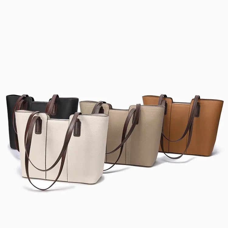 Women's genuine leather large capacity shoulder bag in khaki colour with visible sewing lines and a structured box shape.