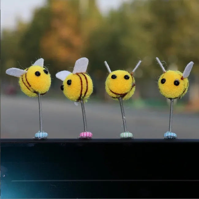 Cartoon bee car decoration ornament with furry ball material measuring 3x3cm