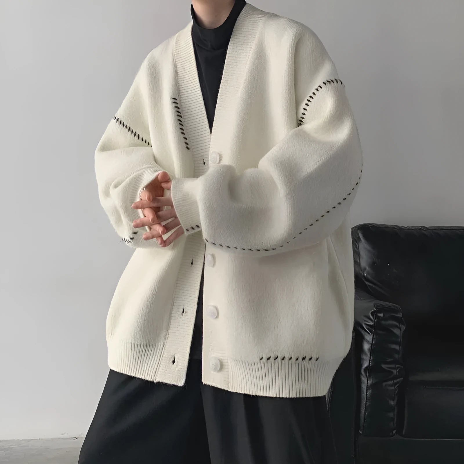Women's loose knitted cardigan coat in solid white or black colour with long sleeves