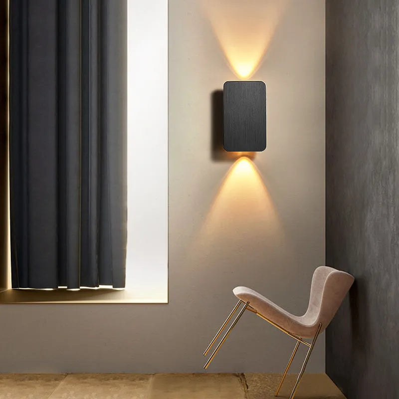 Minimalist Nordic-style LED wall lamp in black finish, mounted on a wall, showing clean lines and modern design.