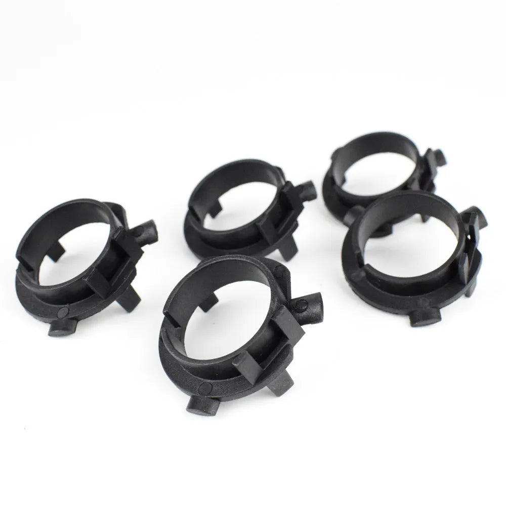 Black ABS plastic LED headlight shaped card holder for car dashboard.