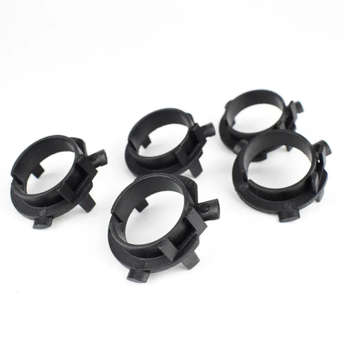 Black ABS plastic LED headlight shaped card holder for car dashboard.