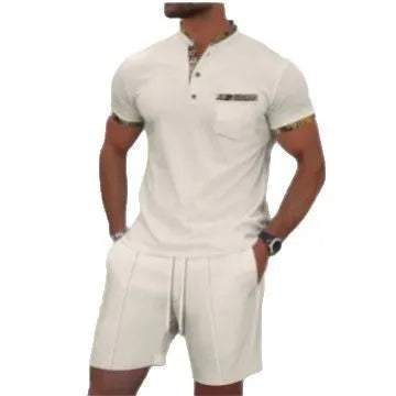 Man wearing a grey waffle knit zip-up polo collar tracksuit with matching shorts for summer leisure.