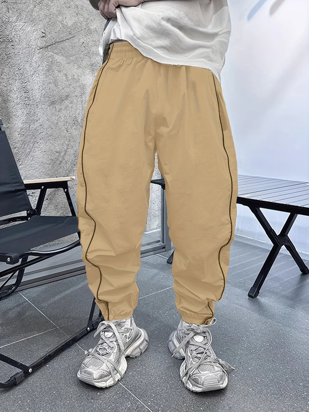 Men's loose-fit cropped casual trousers in bamboo fabric, shown in Army Green colour.