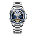 Silver automatic mechanical watch with blue dial on stainless steel bracelet showing transparent caseback