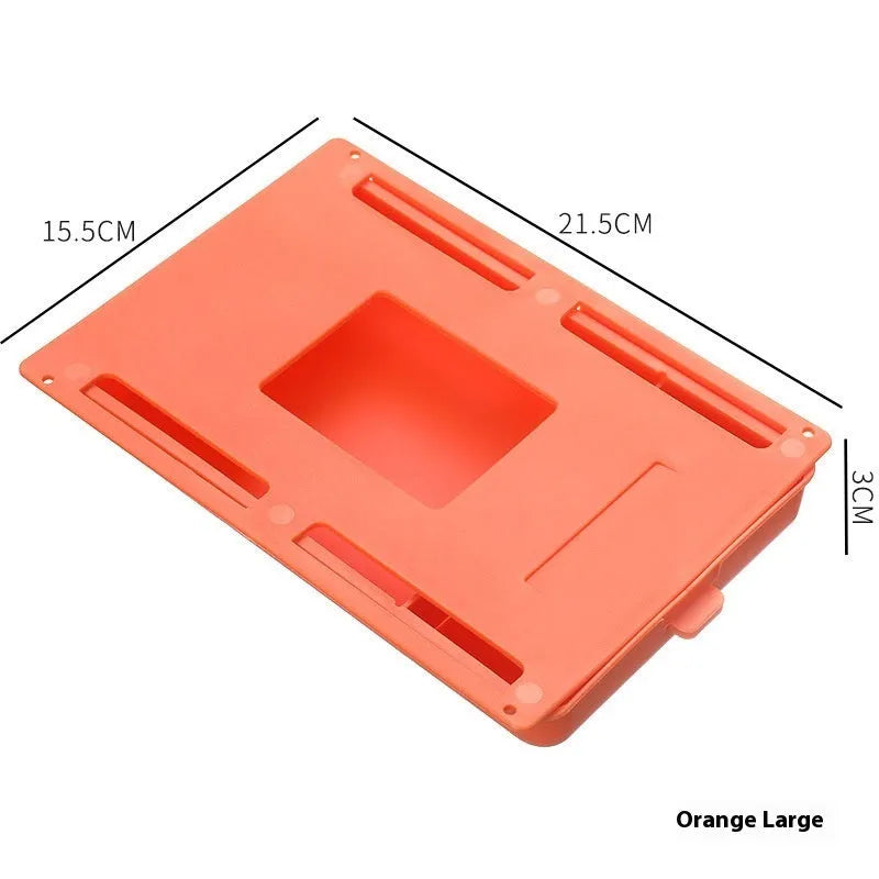 White plastic adhesive under desk storage drawer box with a lid and internal divider grid for organisation.