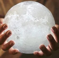 3D printed spherical moon lamp on a wooden stand with touch ring control